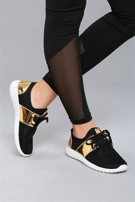 black sneakers with gold trim